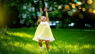 Pure JOY! Chasing bubbles and laughing with her